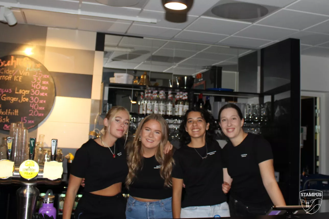 Four girls were working behind the bar. Photo. 